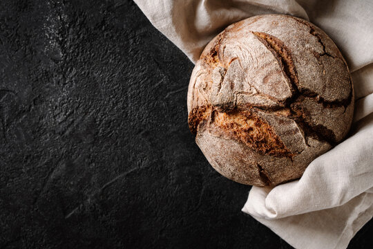 Rustic Bread on Black Slate and Linen Cloth