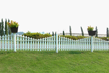 white fence and green grass