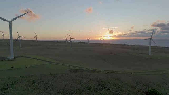 Aerial view of wind turbines at sunset, Hawaii.