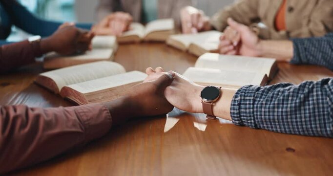 Bible study, group and friends holding hands in prayer for spiritual guidance, religion or belief. Christian community, faith and circle of people in home with worship, support or praise God together