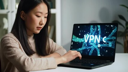 Woman using laptop with network security information on the screen - Powered by Adobe