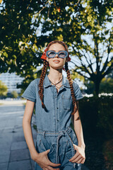 lifestyle woman in modern boho-western denim street style with sunglasses and braids, confident and...