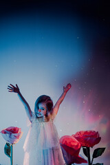 Joyful child celebrating among oversized pink roses in a whimsical setting