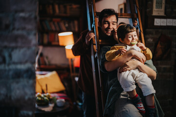 Brightly lit indoor scene capturing a warm family atmosphere where a child is happily playing, evoking comfort and joy.