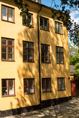 Old yellow building on a quiet Stockholm street