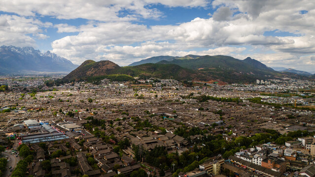 Aerial Dayan, the Old Town of Lijiang, in Yunnan, China, traditional Chinese architecture UNESCO world heritage - Powered by Adobe