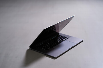 Modern Silver Laptop on Minimalist Background for Business and Technology
