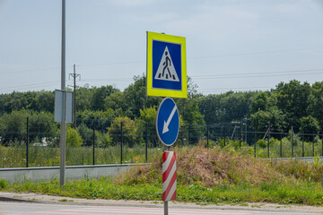 Road signs provide instructions for drivers, signaling upcoming construction and guiding traffic...