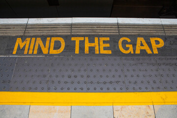 Mind The Gap Sign on a Railway Platform in London, UK
