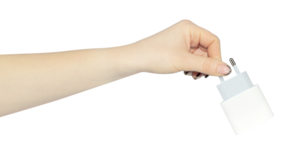 Original network charger for phone in hand, outstretched hand with network charger for phone, isolated from background, concept of using only safe branded devices