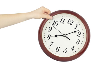 round wall clock in hand, outstretched hand with round wall clock isolated from background, time concept
