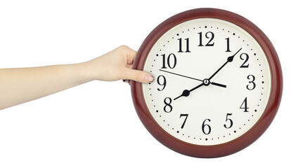 round wall clock in hand, outstretched hand with round wall clock isolated from background, time...