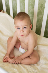 Toddler with Chickenpox Sitting in Bed