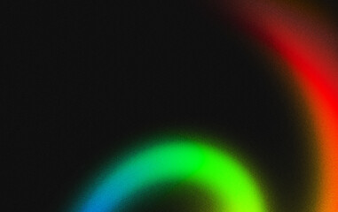 Softly glowing arc of cyan and green with a hint of red against a dark speckled surface