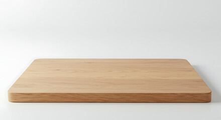 A clean and simple wooden cutting board, showcasing its natural wood grain and smooth surface, isolated on a bright white background, ready for food preparation.
