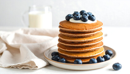 Delicious gluten-free buckwheat pancakes served on ceramic plate with blueberries