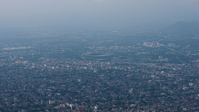 Drone view of Mexico City's Estadio Azteca, encircled by extensive housing zones