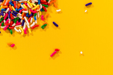 Scattered Rainbow Sprinkles With Minimal Background