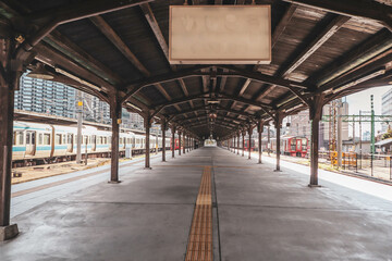Historic Mojiko Station Platform with Traditional Wooden Architecture and Train in Fukuoka, Japan