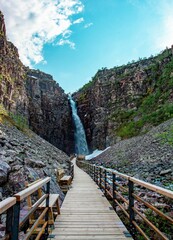 Wooden Walkway to Waterfall in Canyon