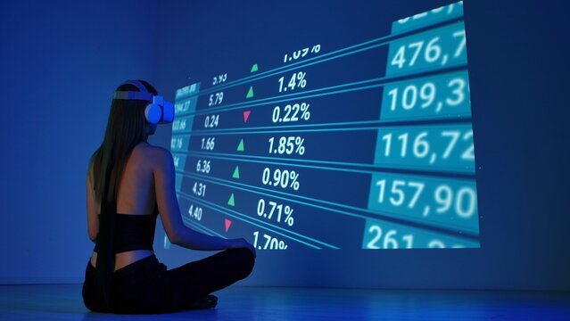 Woman Observing Stock Market Data in Virtual Reality - Powered by Adobe