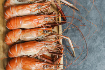 Closeup of the steamed river prawns on the wood plate, Thailand food