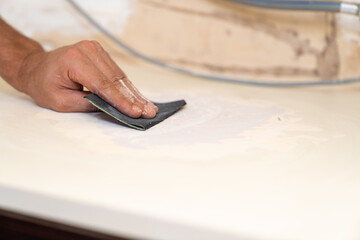 Close up of sanding surface with paper.