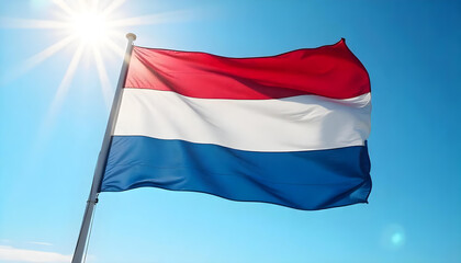 Dutch Flag Flying in the Wind with Sunlight and Blue Sky Symbolizing National Identity, Freedom, European Heritage and Pride of the Kingdom of the Netherlands