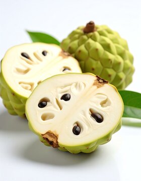 Half-cut Thai custard apple (Noina) isolated. Fresh cherimoya fruit cut in half on white background.