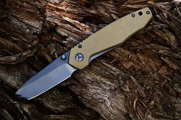 Folding tourist, camping knife with black blade and a handle mad