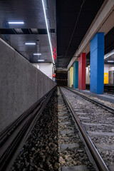 View of rails in a subway station.