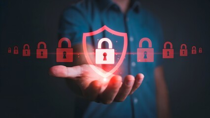 Person presenting a digital security shield and lock icons, symbolizing data protection, secure systems, and strong cybersecurity measures, with a blurred background accentuating  technology concept.