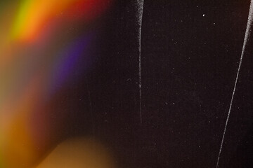 retro film overlay effect with scratch dust and light leaks,retro grain noisy film distressed texture light leak flare on black background