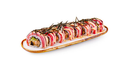 Sushi roll delicately arranged on a white plate with garnishes