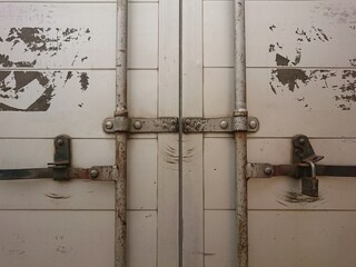 Weathered metal doors and locking mechanism