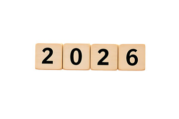 Four light brown wooden blocks spelling out the black word '2026' arranged on white background