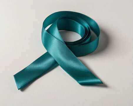 Teal satin ribbon coiled and draped fabric material