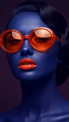 Close-up of blue face with orange sunglasses and lipstick, showcasing bold color contrast and retro style, symbolizing fashion, glamour, and artistry © Inspire Shots Hub