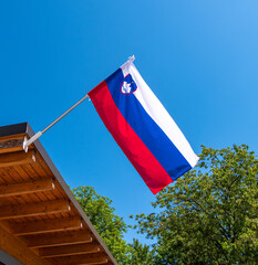 Slovenian Flag Waving in Blue Sky