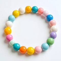 Circle of glossy, pastel-toned spheres creating a playful and vibrant composition on white background