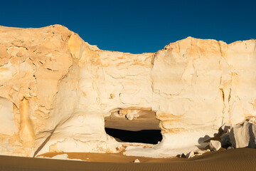 White rock formations and sand dunes in Egypt's White Desert, natural desert landscape	