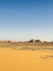 White rock formations and sand dunes in Egypt's White Desert, natural desert landscape	