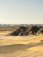 White rock formations and sand dunes in Egypt's White Desert, natural desert landscape	