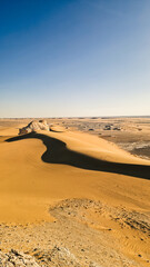 White rock formations and sand dunes in Egypt's White Desert, natural desert landscape	