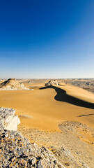 White rock formations and sand dunes in Egypt's White Desert, natural desert landscape	