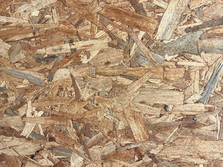 Brown wooden background. Chipboard sheet. Construction material