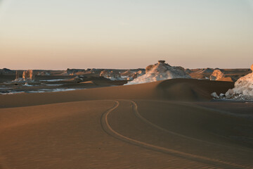 White rock formations and sand dunes in Egypt's White Desert, natural desert landscape	