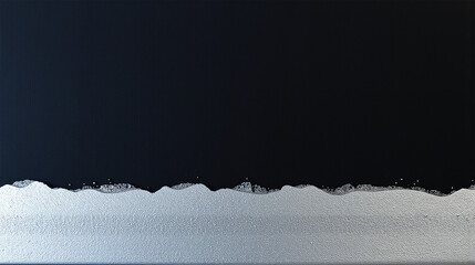 A modern abstract artwork depicting a stark contrast between dark and light, resembling ocean waves meeting a horizon.