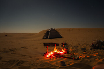 Campfire in the night camp in the White Desert in Egypt. Fire under the sky	