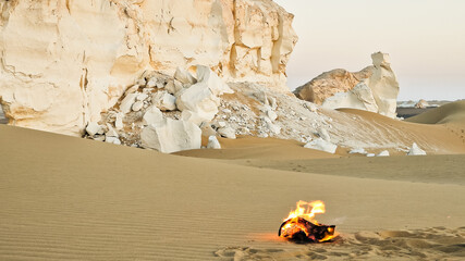 Campfire in the night camp in the White Desert in Egypt. Fire under the sky	